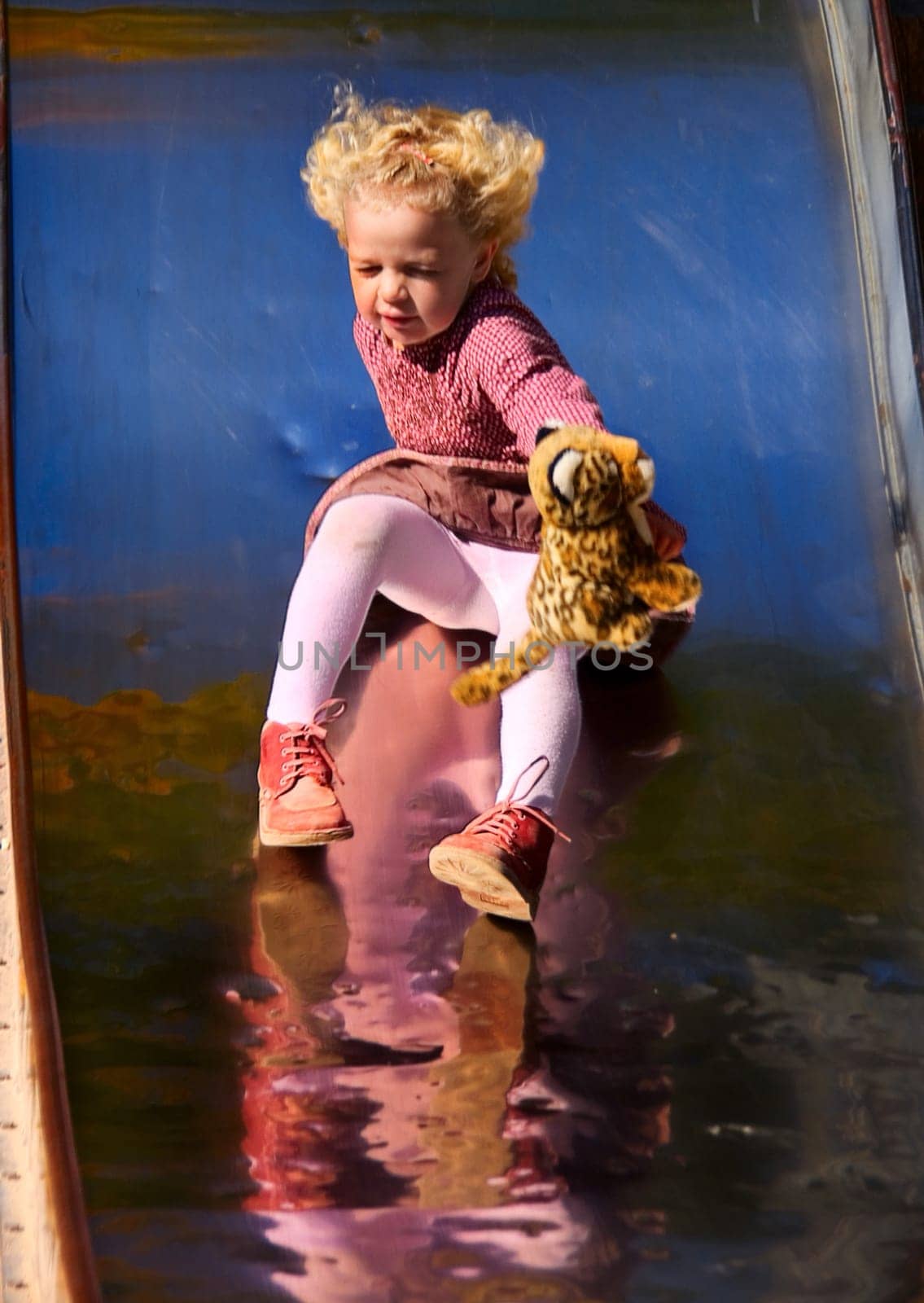 ... a rapid ride,she is not quite terrified,protectively she stretches her panther away from her....