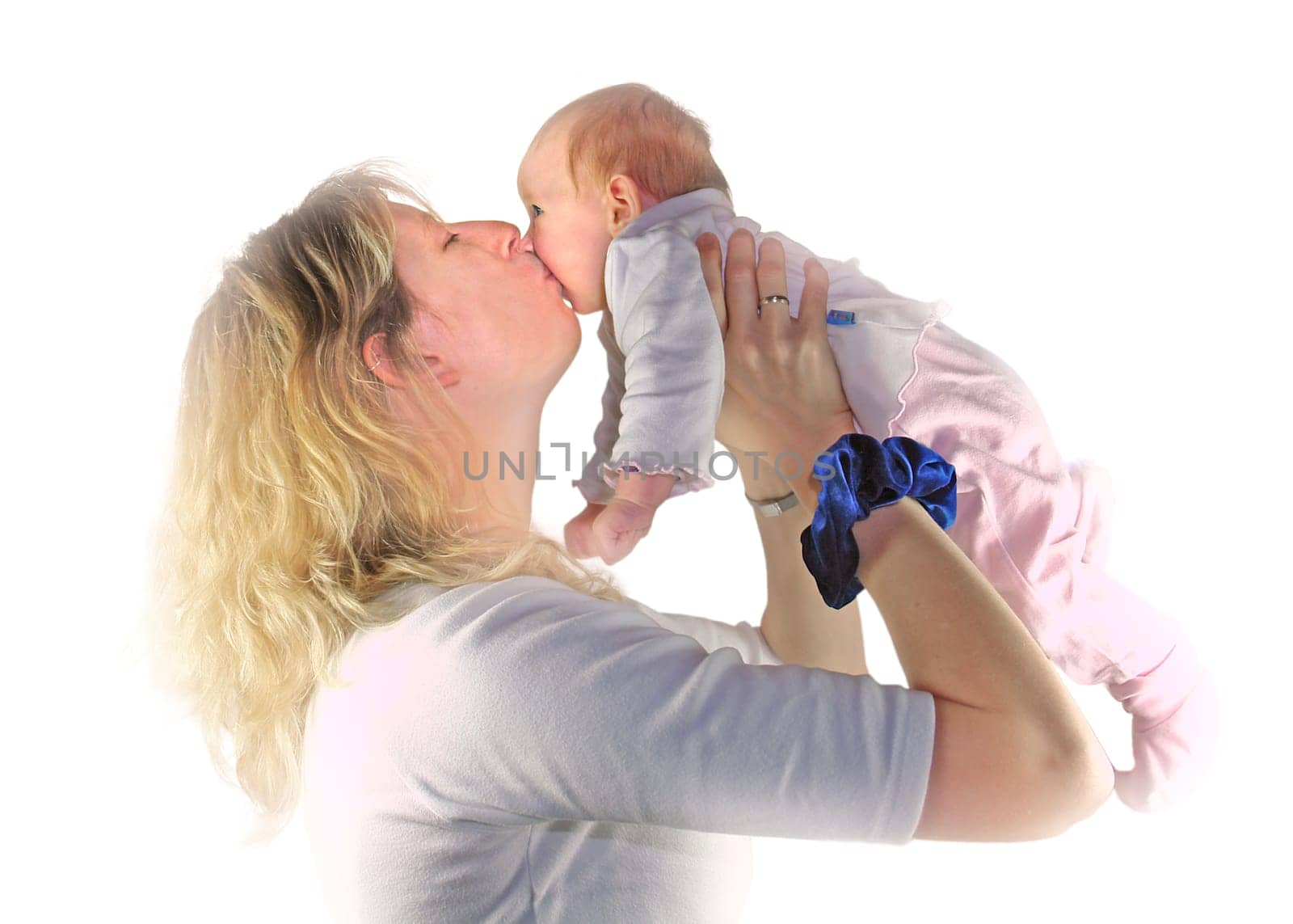 Mother kissing her baby