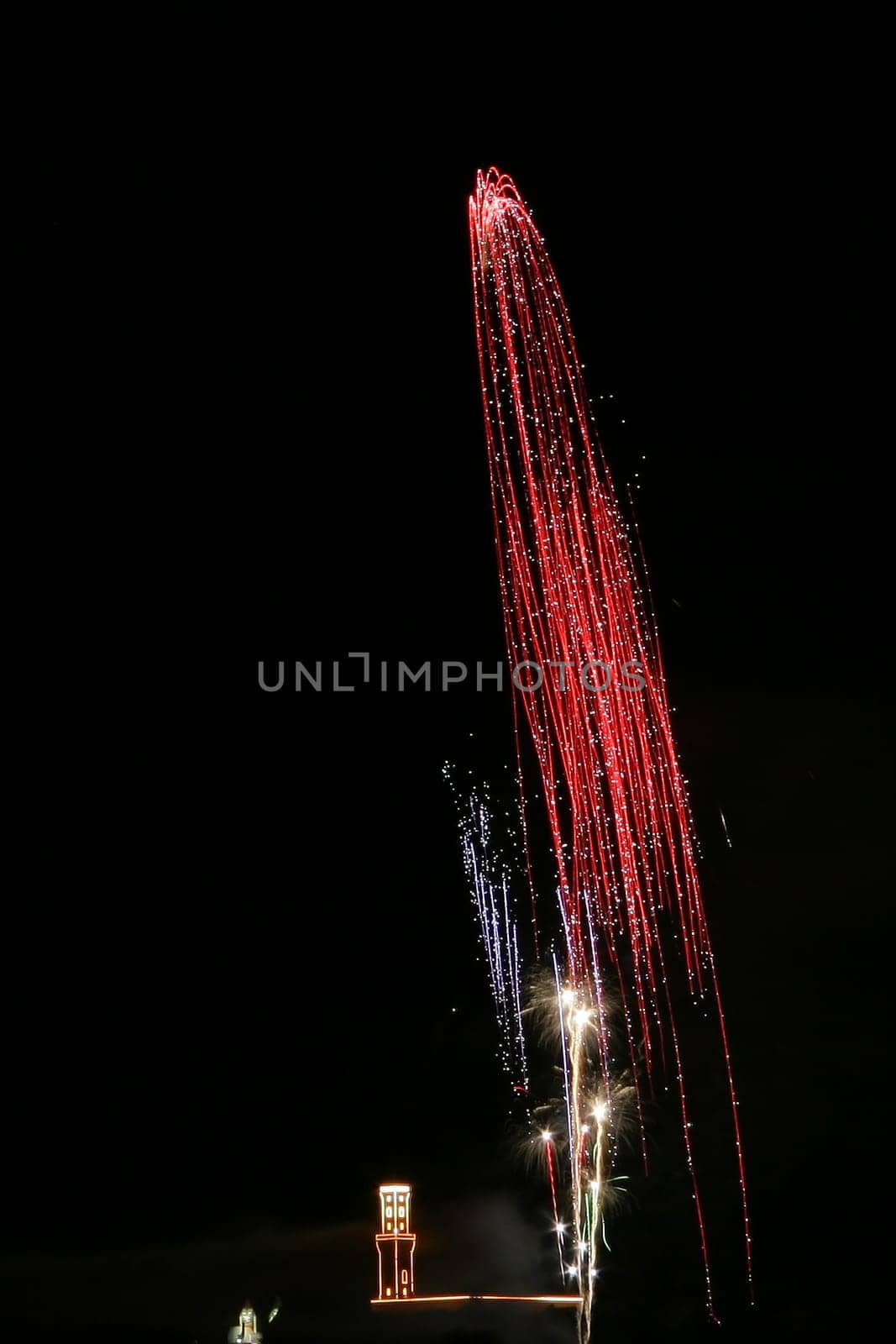 The final fireworks display of the Fürth Michaeliskirchweih with illuminated town hall