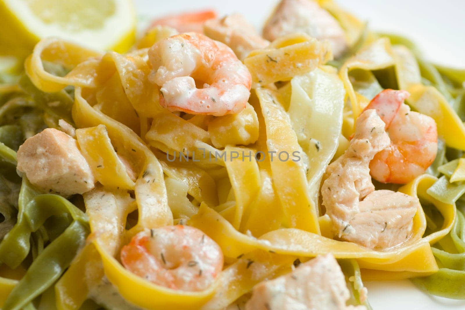 Ribbon noodles with salmon and prawns