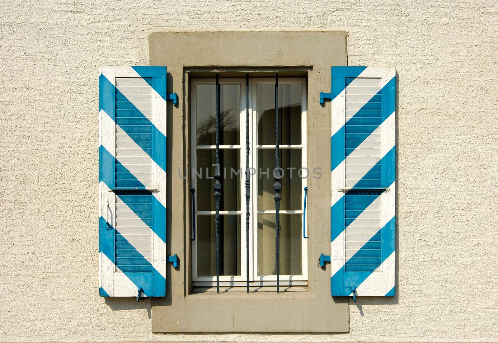 Country house with blue and white shutters
