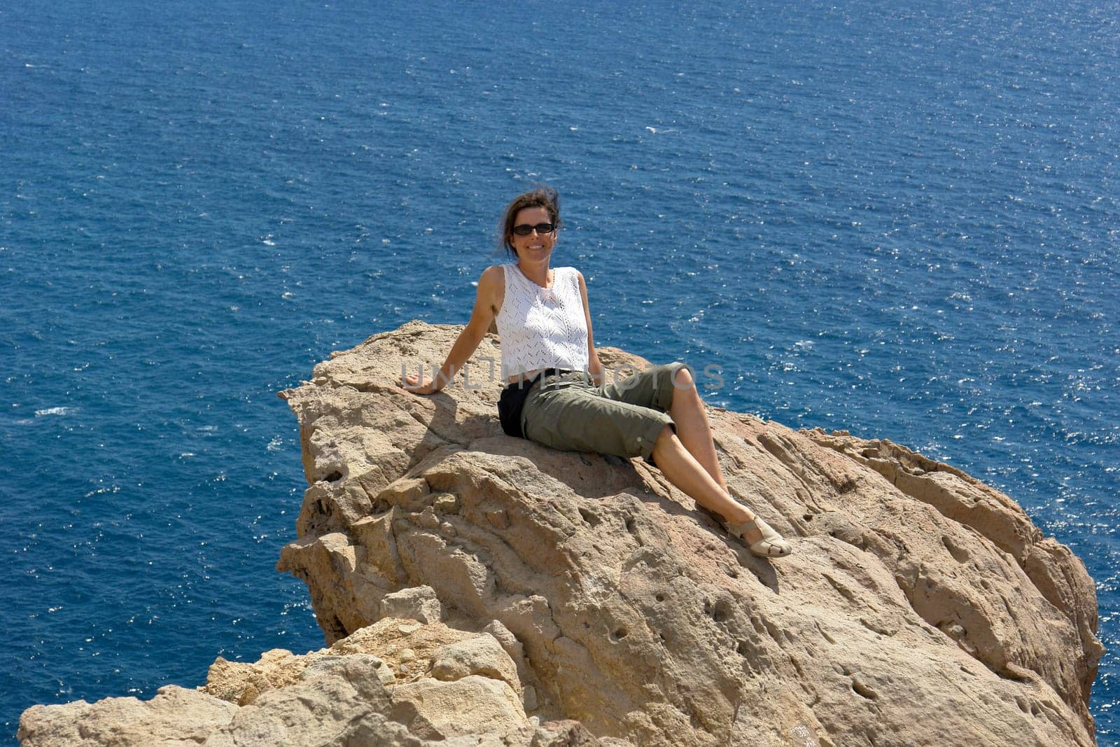 Young woman on rock