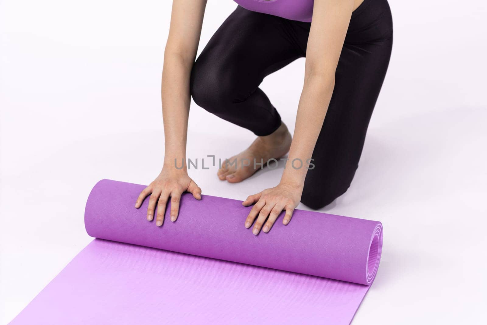 Young attractive asian woman portrait in sportswear with exercising mat. Healthy exercise and workout routine lifestyle concept. Studio shot isolated background. Vigorous