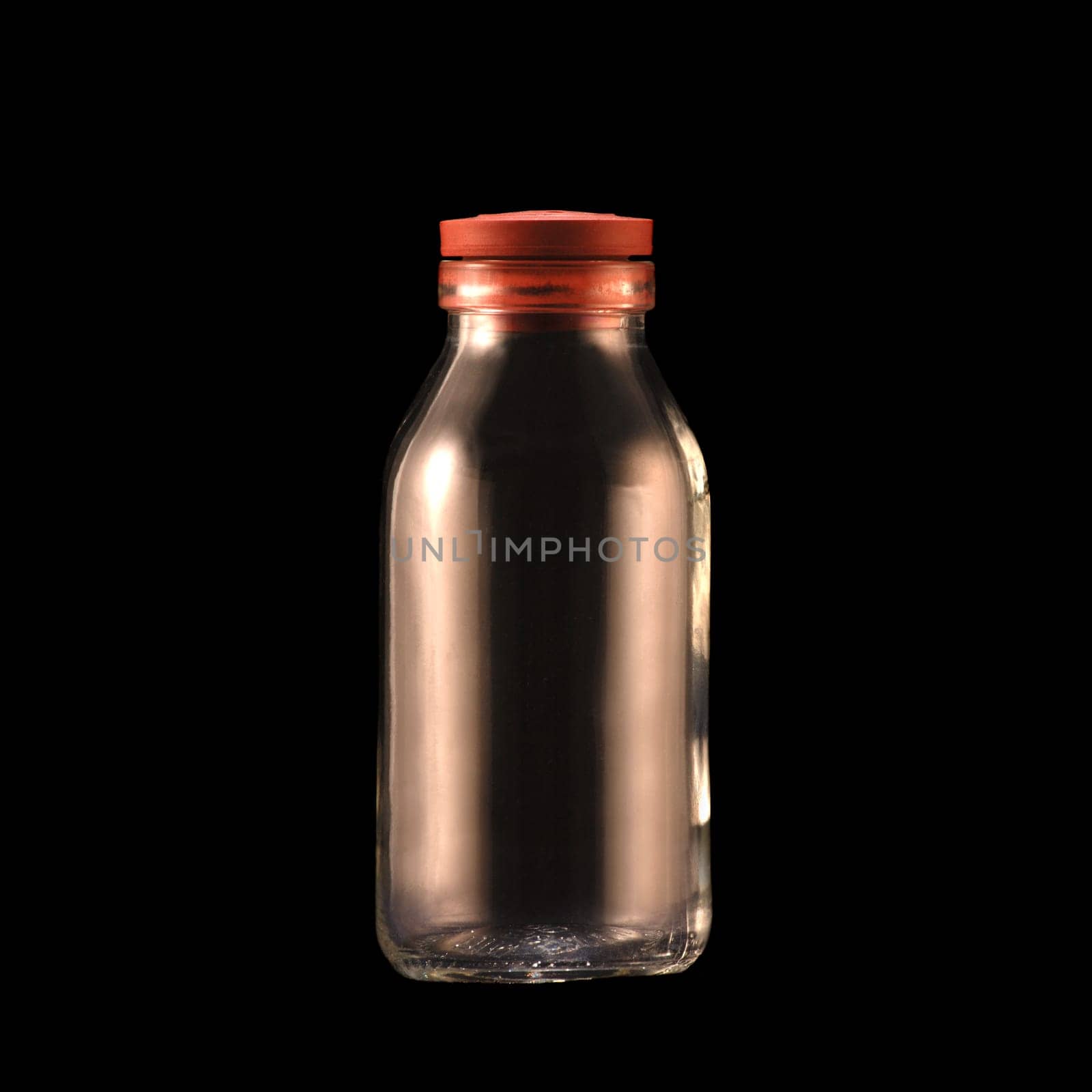 Milk bottle in front of black