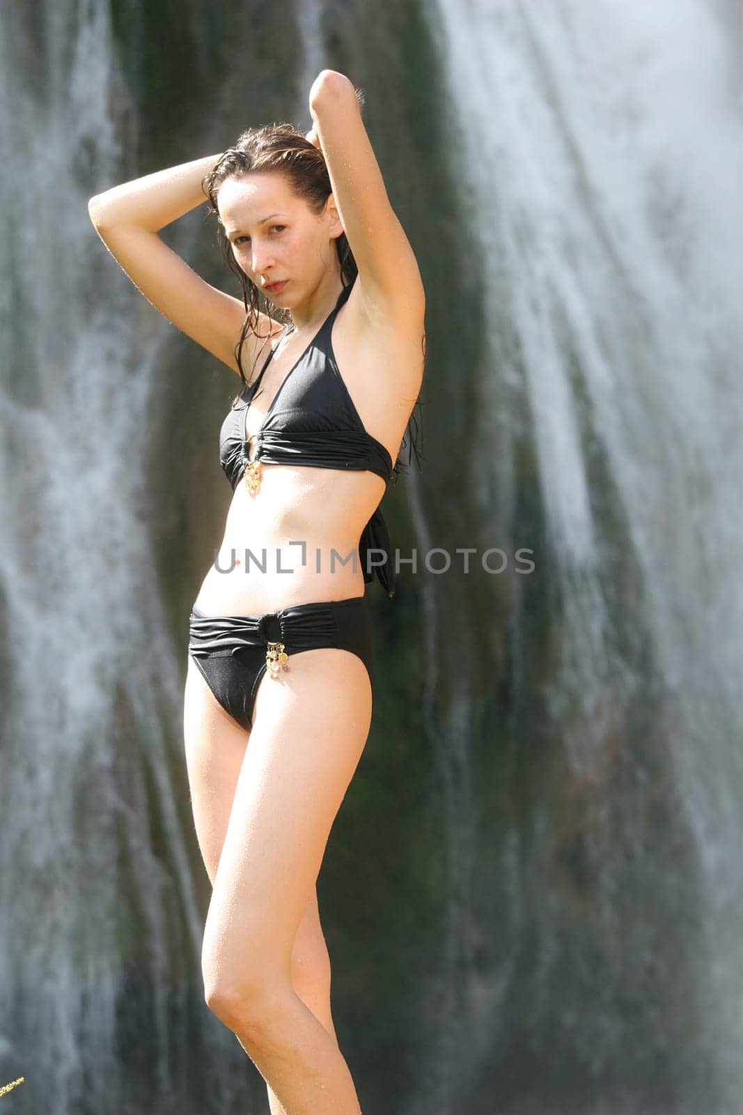 Woman at the waterfall