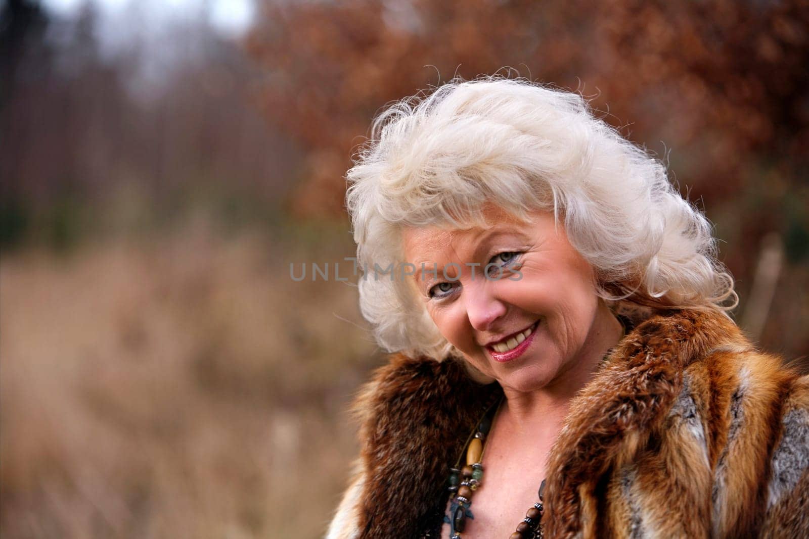 white-haired woman late 50's