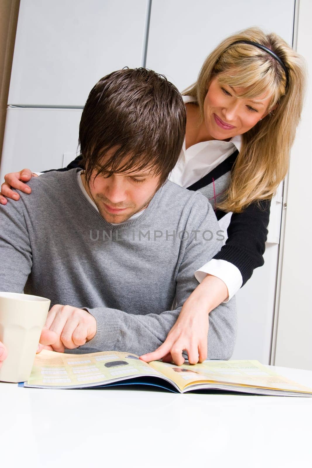 couple reading magazine