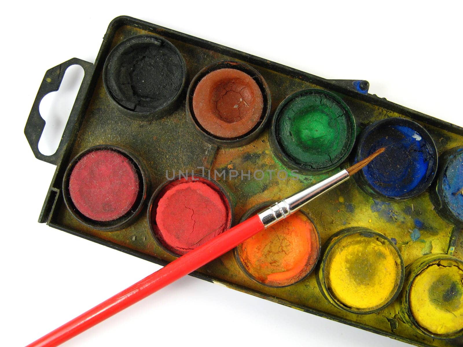 Watercolor box and red paintbrush
