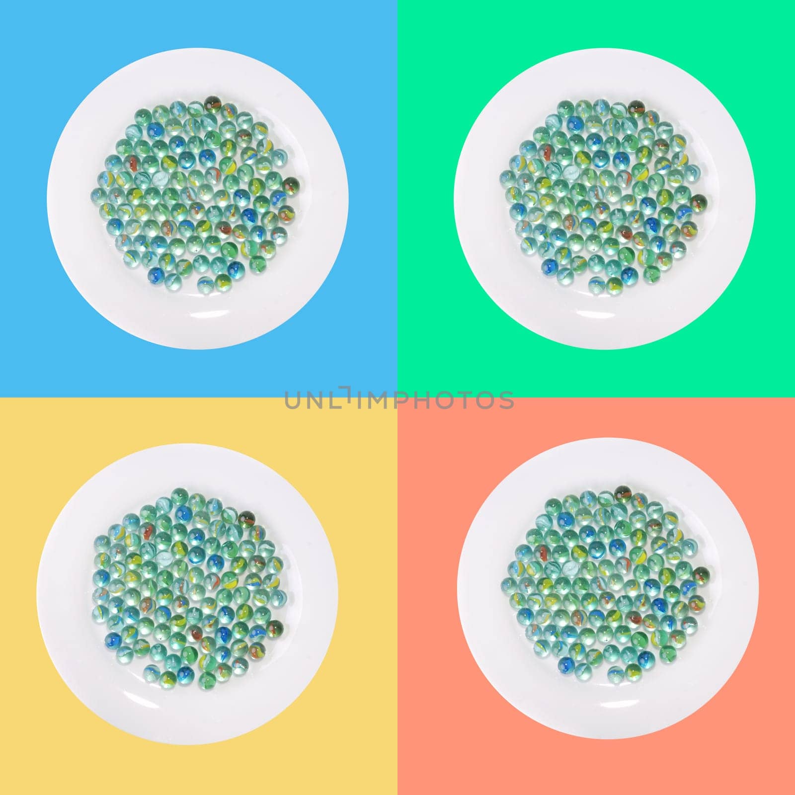 4 plates with glass marble in front of paint