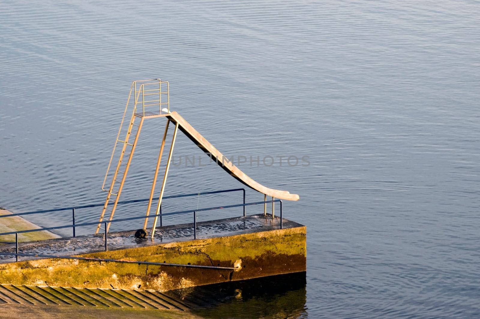 Slider by the calm sea
