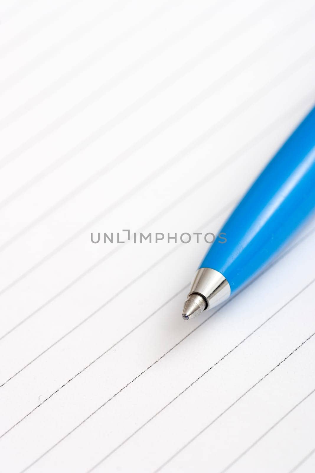 blue pen on notepad