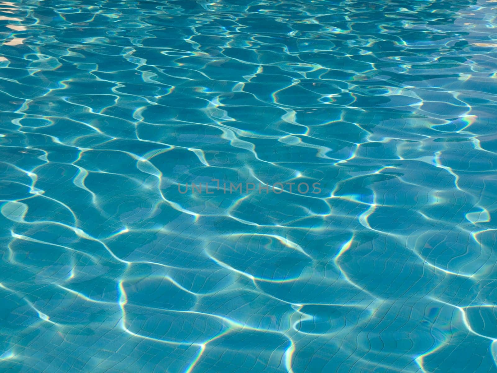 Light blue water surface of a pool