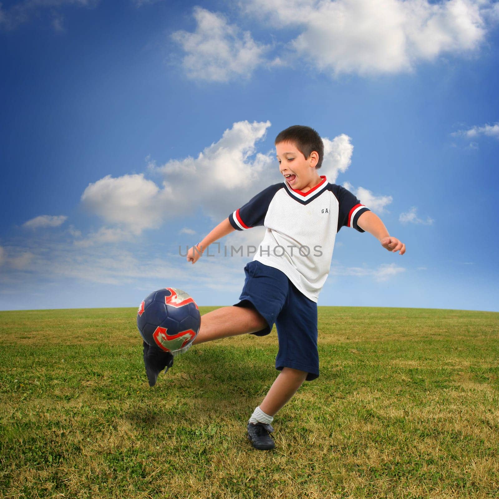 kid playing soccer outside