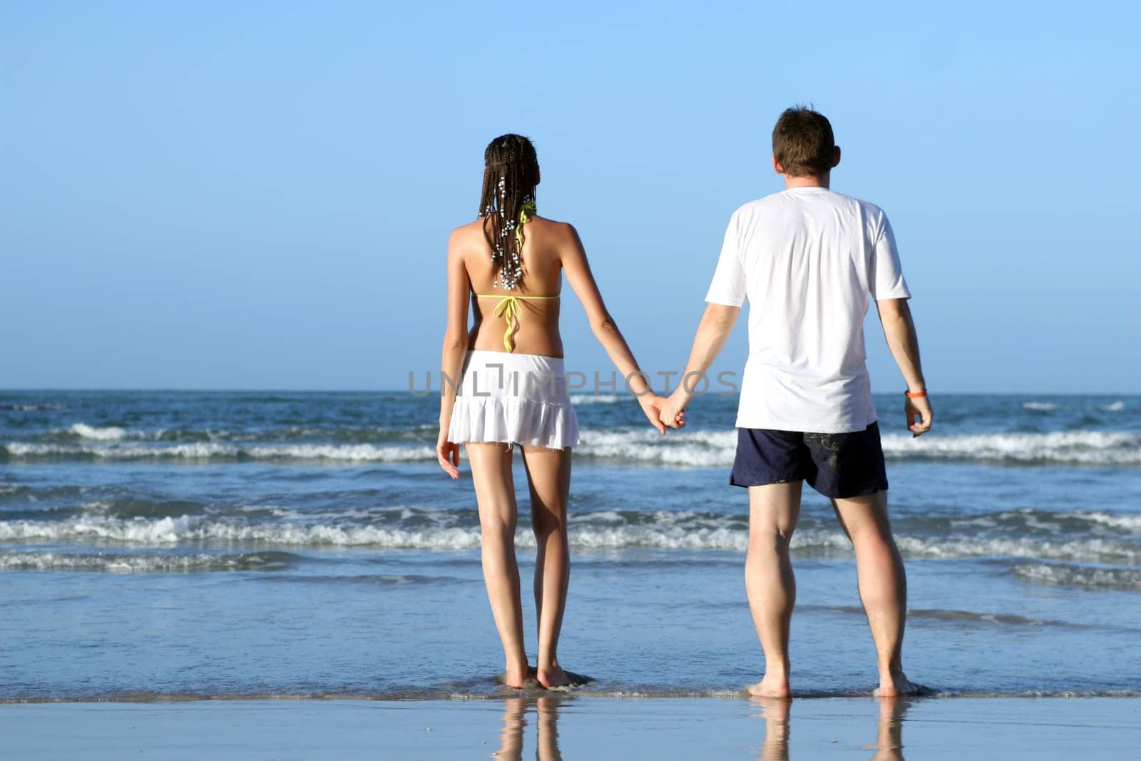 Hand in hand on the beach