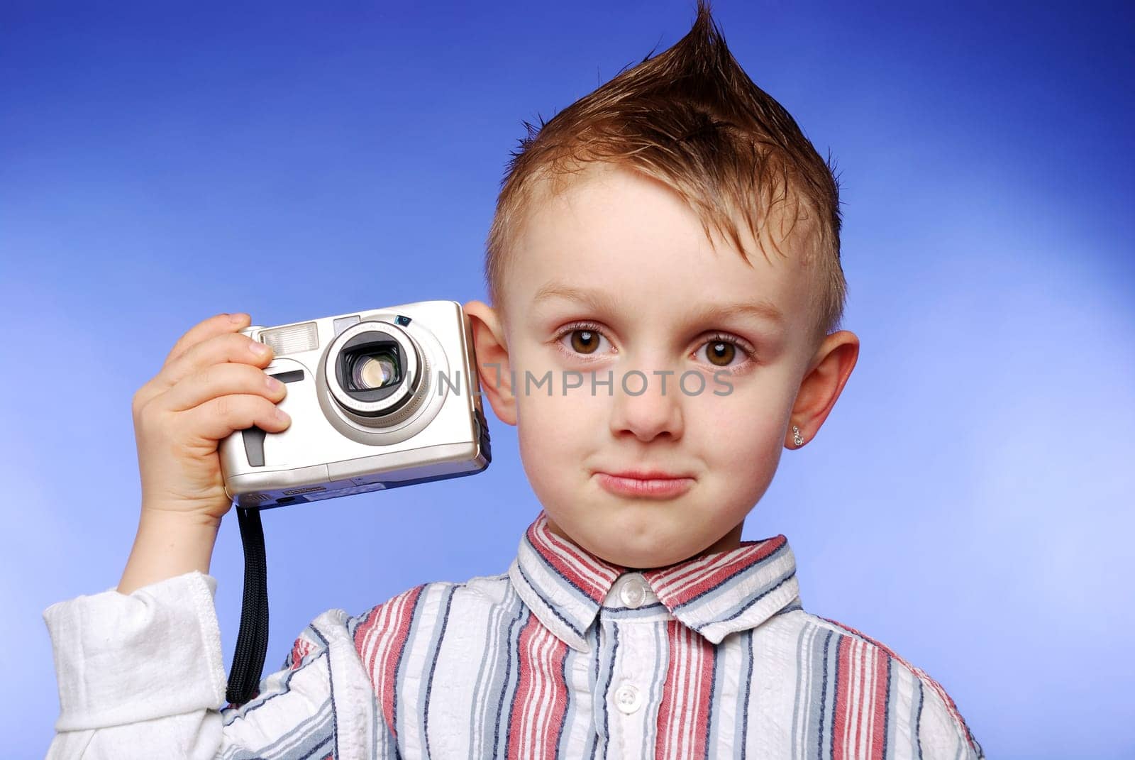 Boy with digital camera