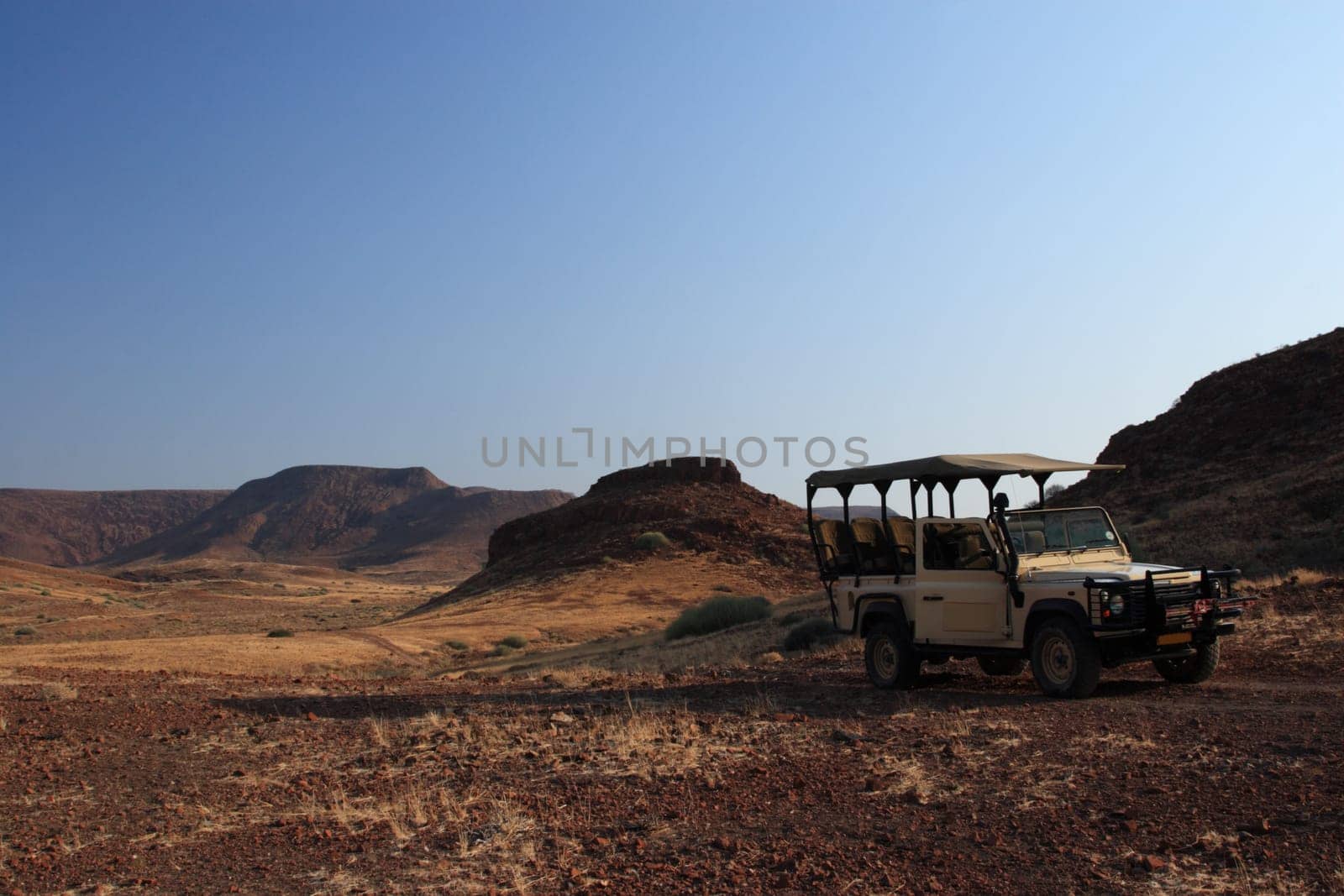 Land Rover in front of landscape panorama
