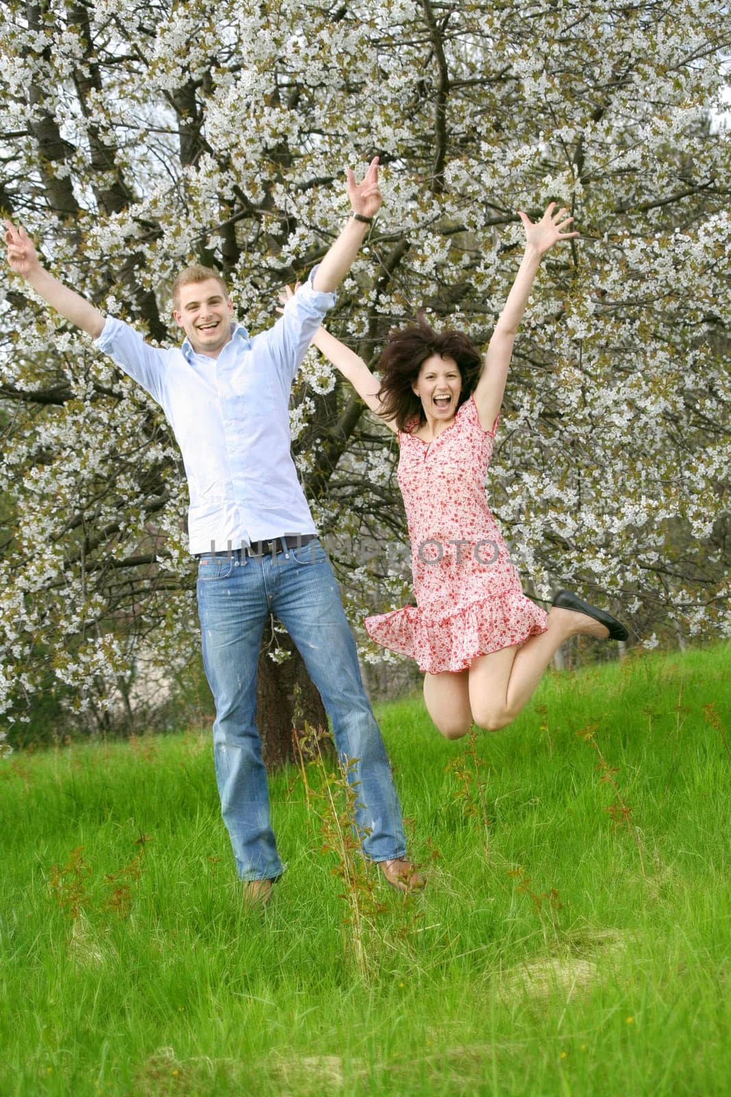 Happy couple jumping