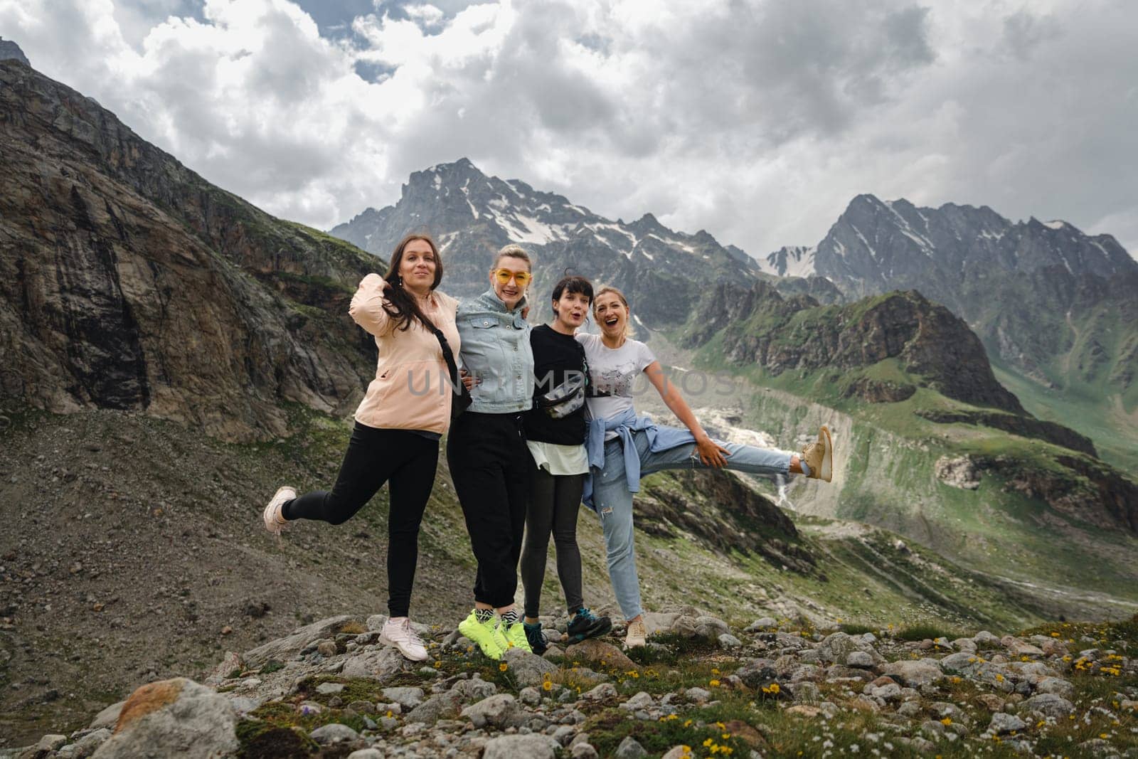 A group of girlfriends climbed high in the mountains