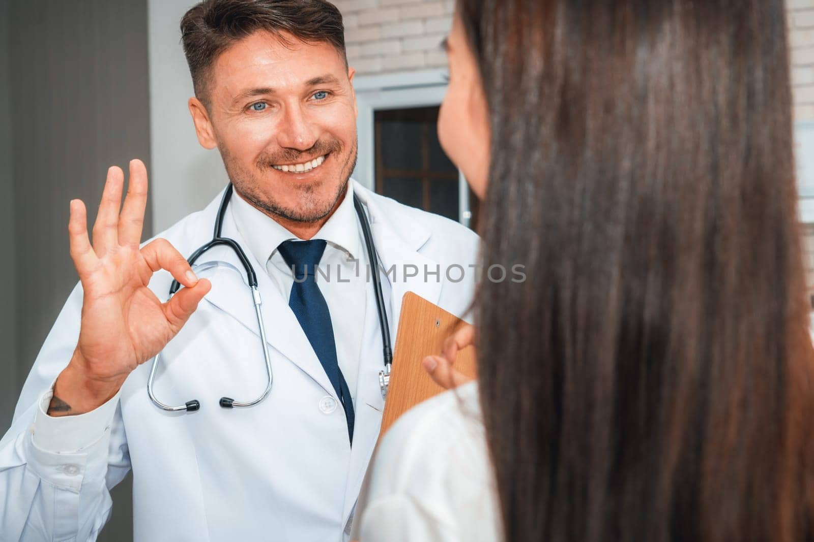 Doctor in professional uniform examining patient at hospital or medical clinic. Health care , medical and doctor staff service concept. Jivy