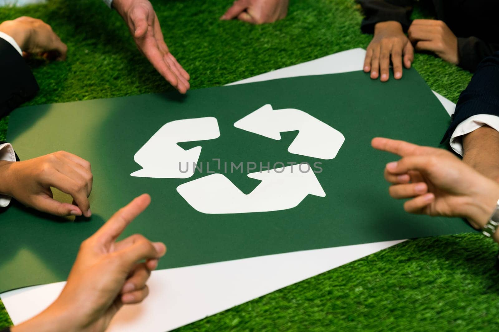 Recycle icon on meeting table in office with business people planning eco business investment on waste management as recycle reduce reuse concept for clean ecosystem. Quaint