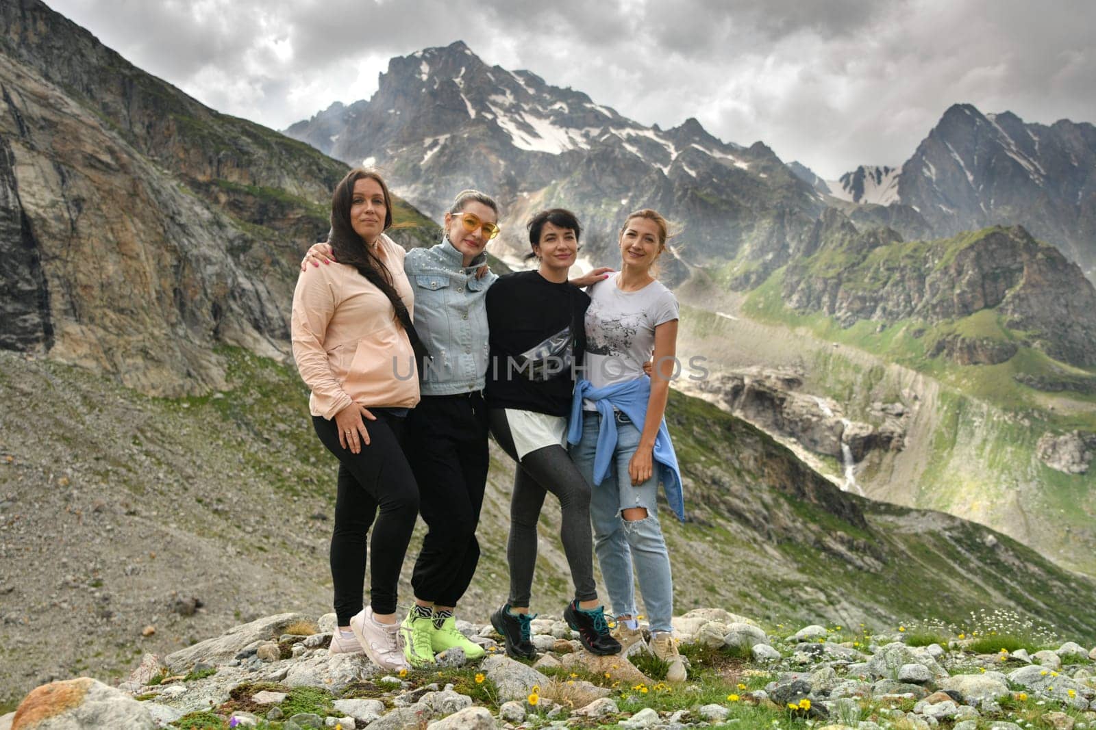 A group of girlfriends climbed high in the mountains