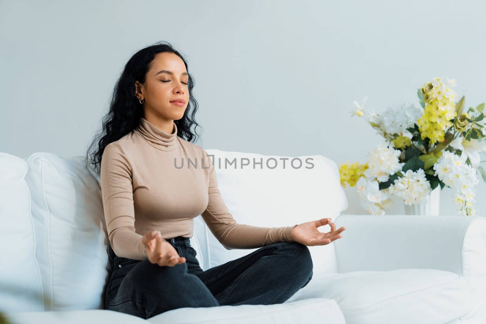 Young African American woman practice crucial mindful meditation at home by biancoblue