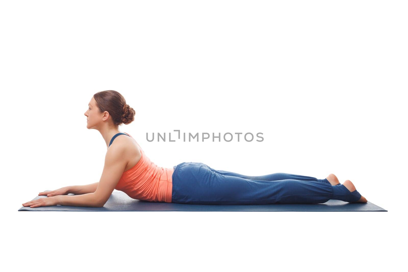 Beautiful sporty fit yogini woman practices yoga asana salamba bhujangasana - sphinx pose beginnner backbend variation isolated on white