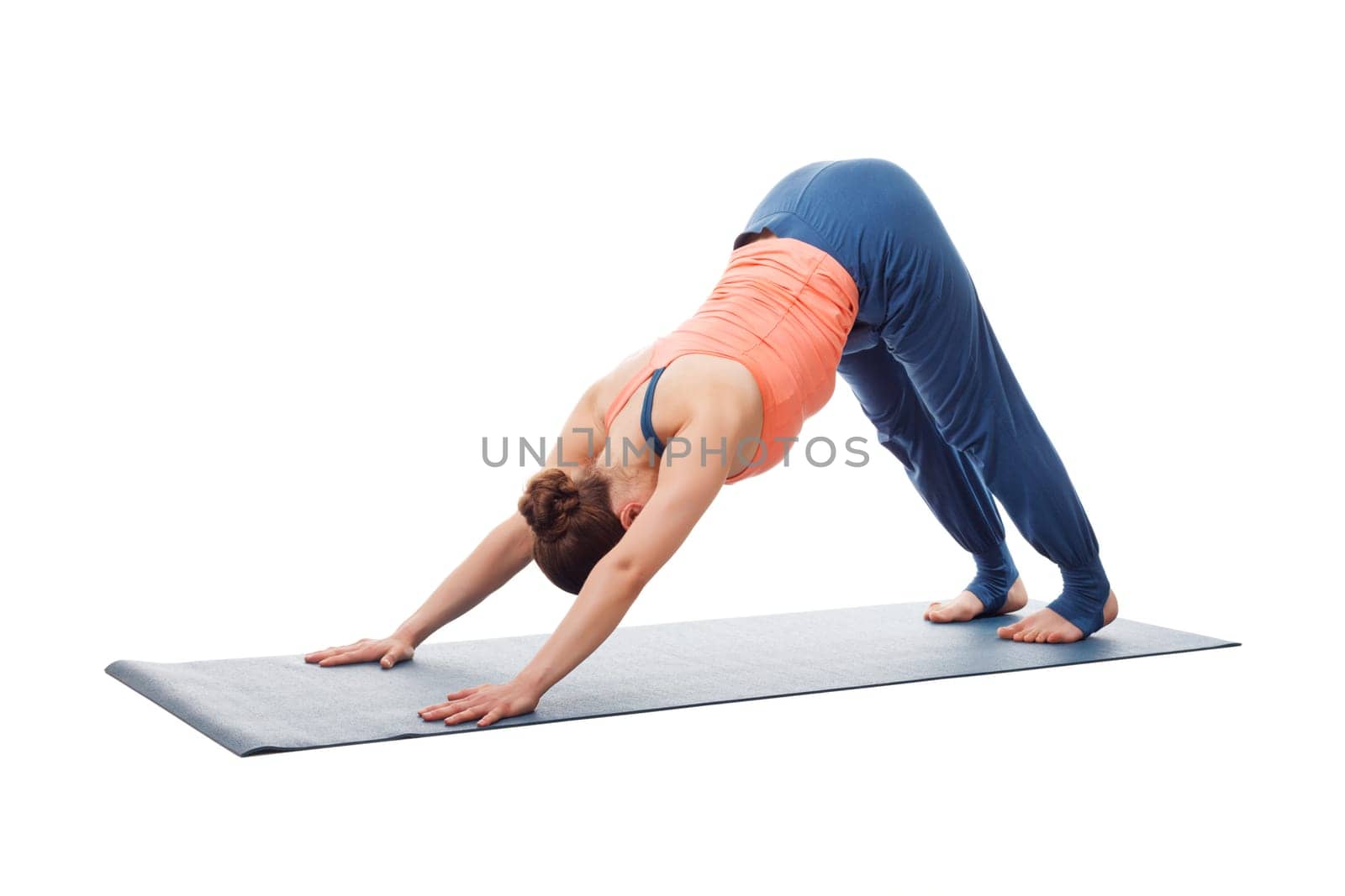 Beautiful sporty fit yogi girl practices yoga asana adhomukha sv by dimol