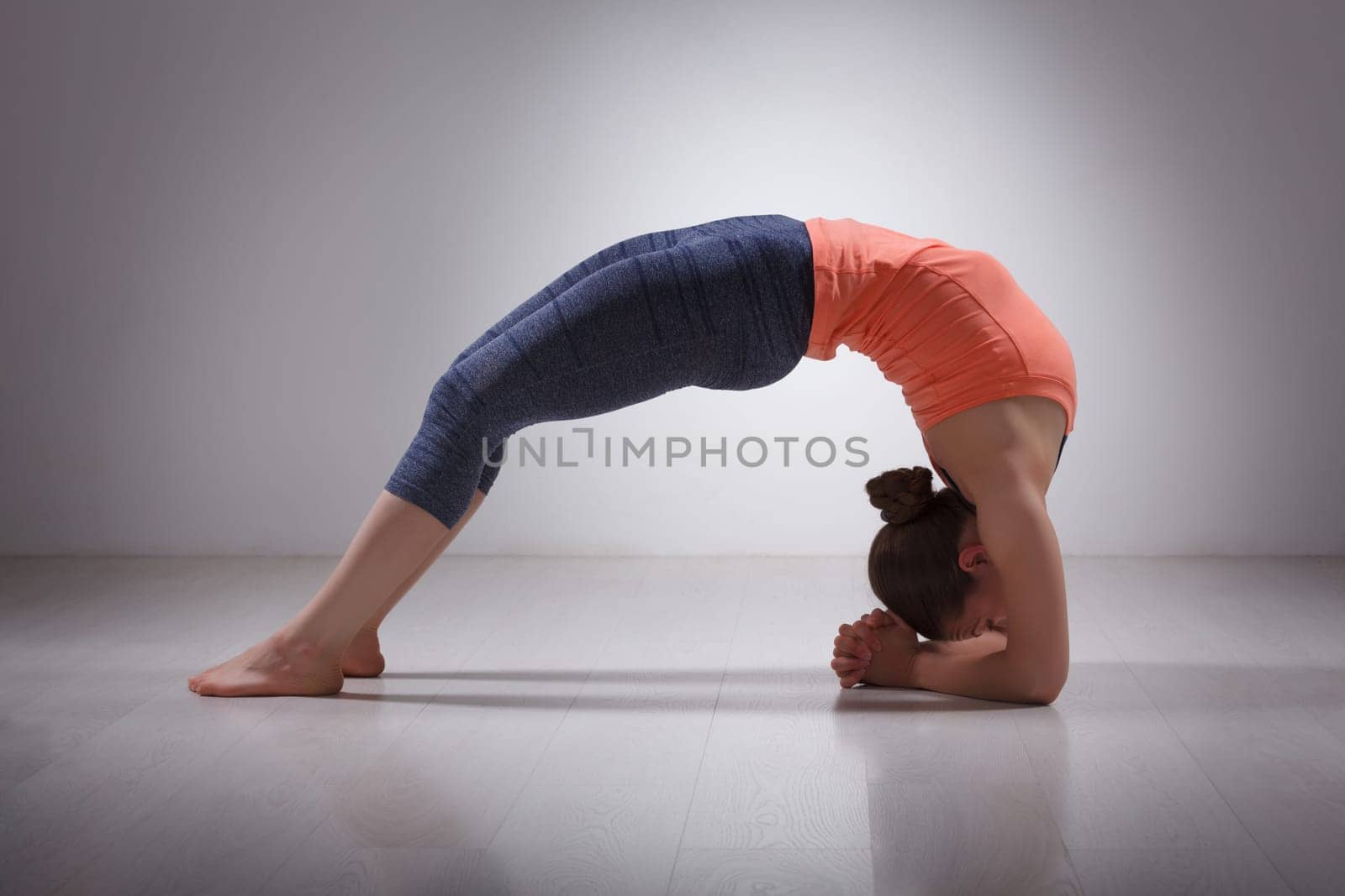 Beautiful sporty fit yogi girl practices yoga asana viparita dan by dimol