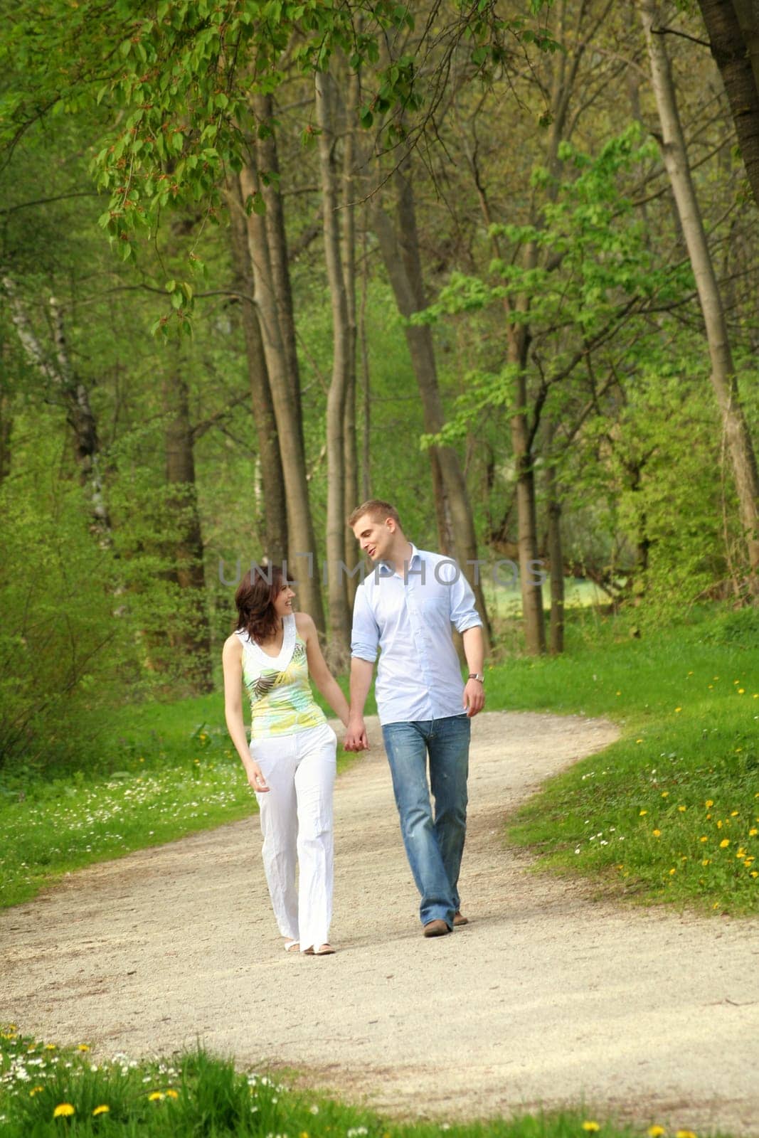 Happy couple in the park while walking