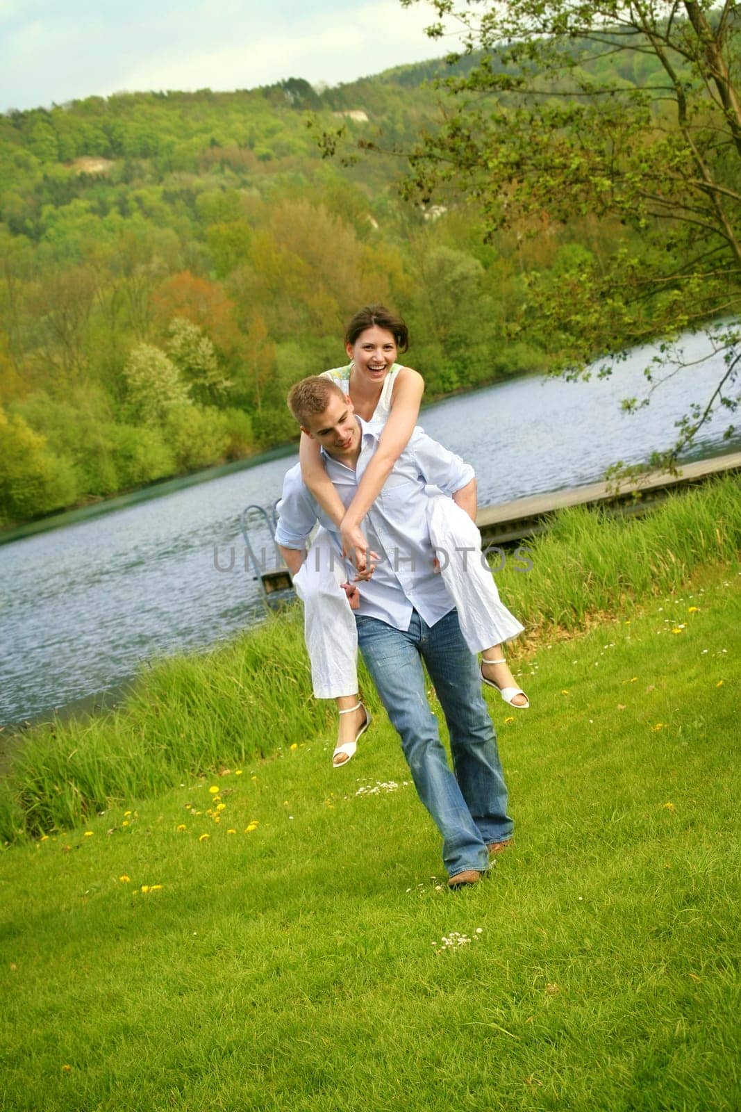 Happy couple on a meadow