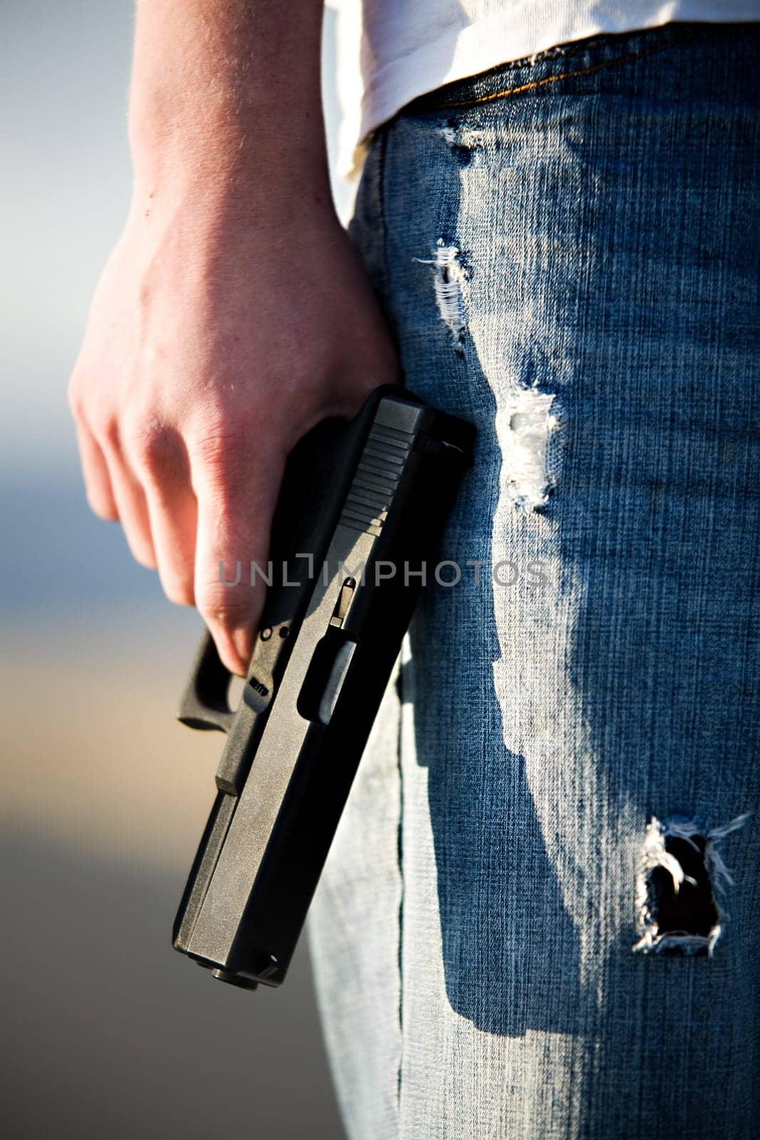 teen with handgun
