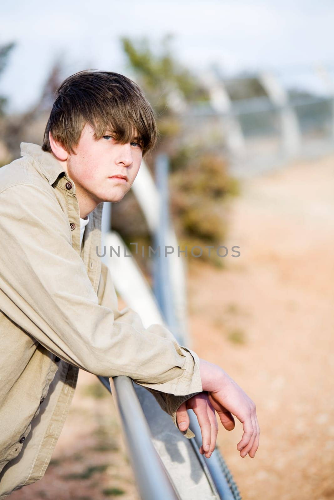 teen on fence portrait