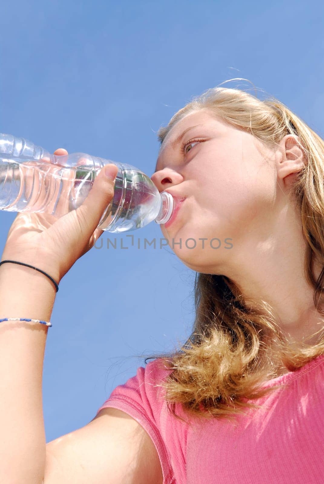 Young girl drinking water