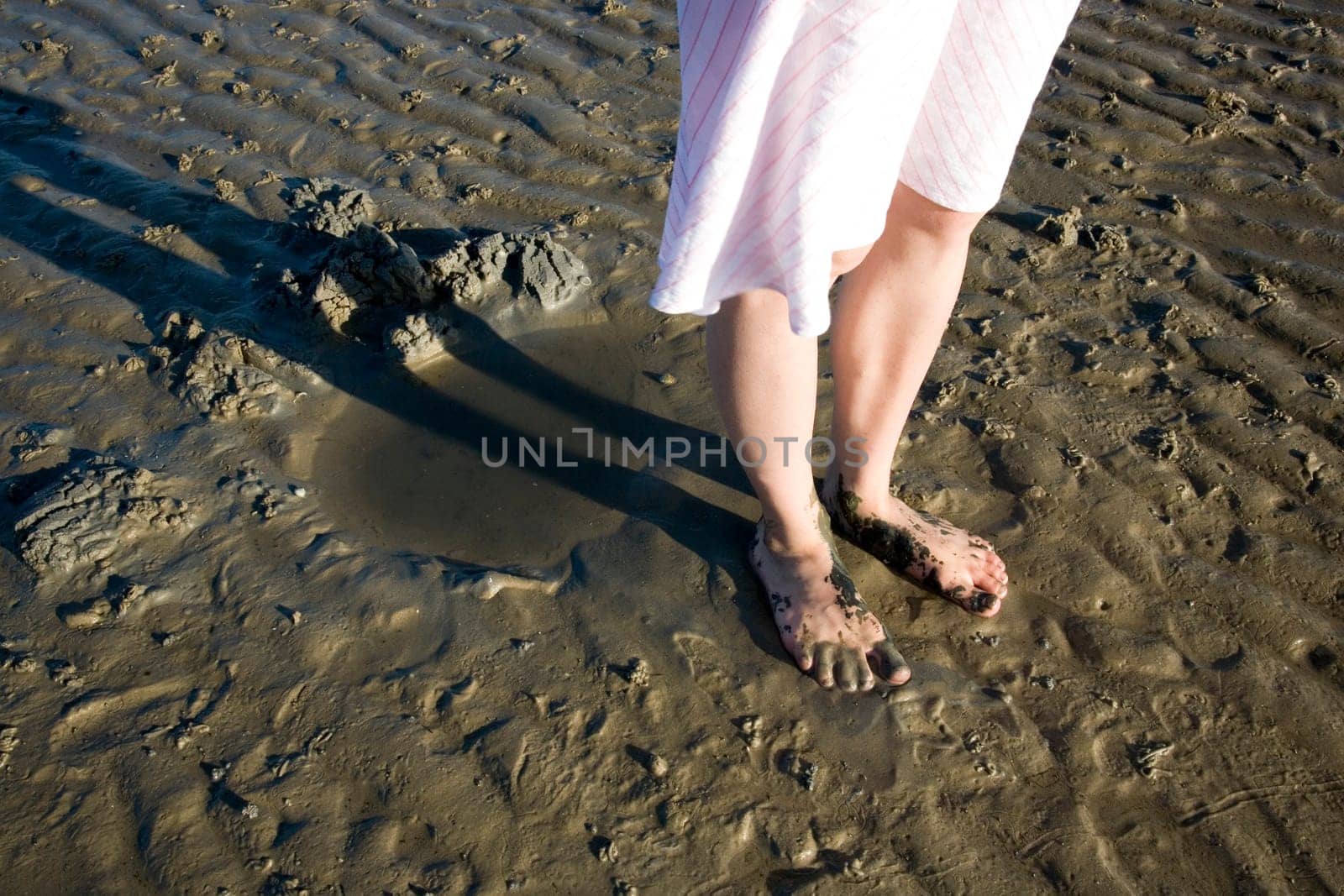 bare feet in the mudflats