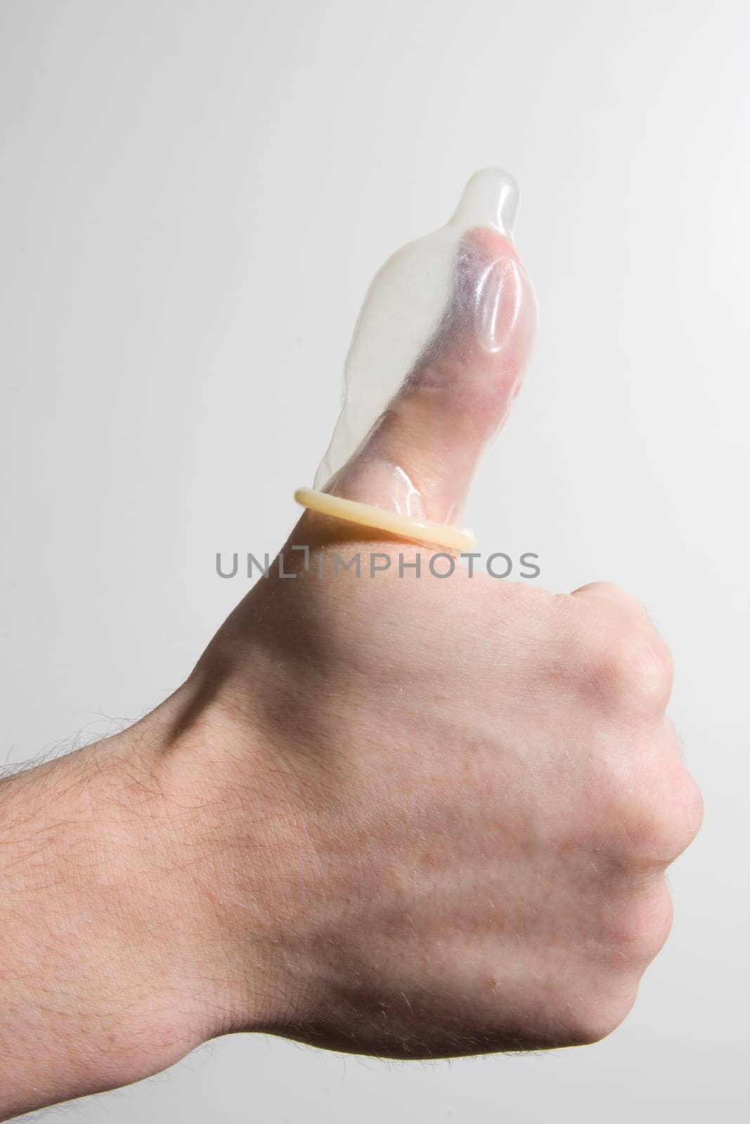 hand holding condom