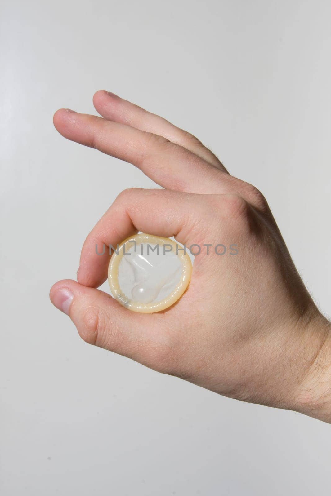 hand holding condom