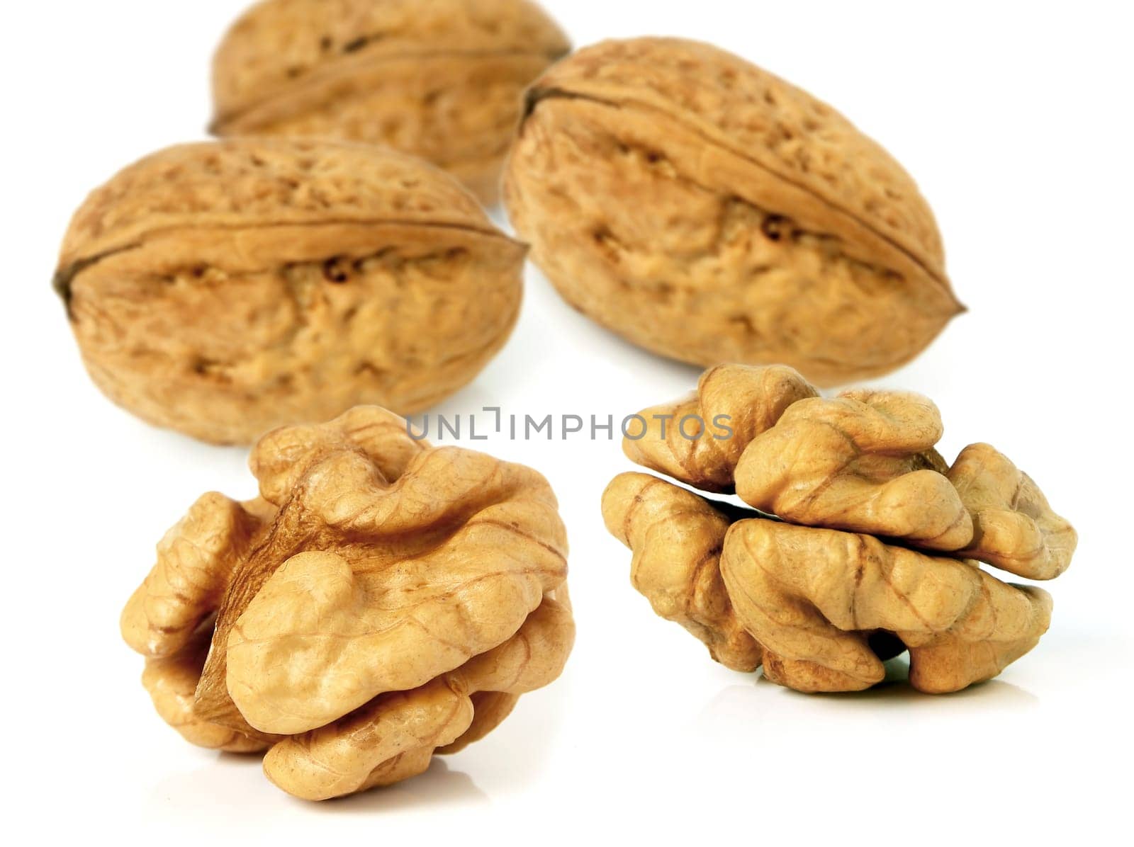 Walnuts in closeup with white background
