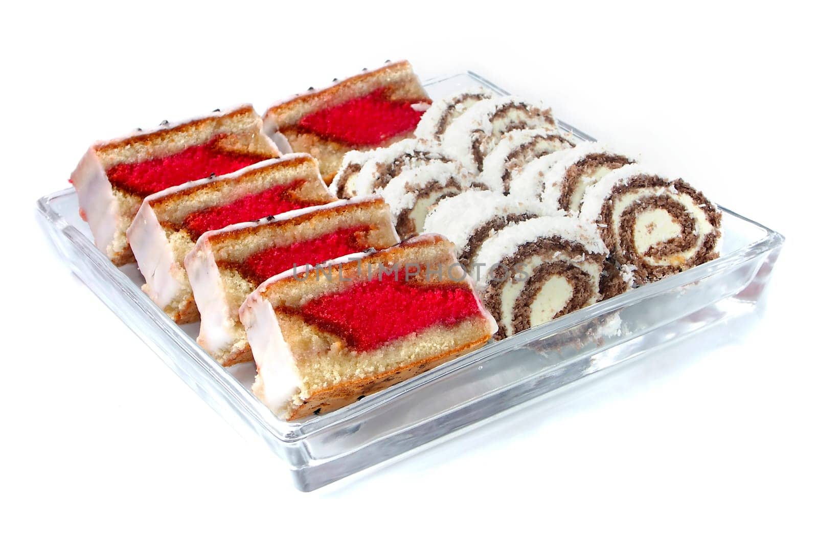 Rum-tea and coconut sweets on glass plat