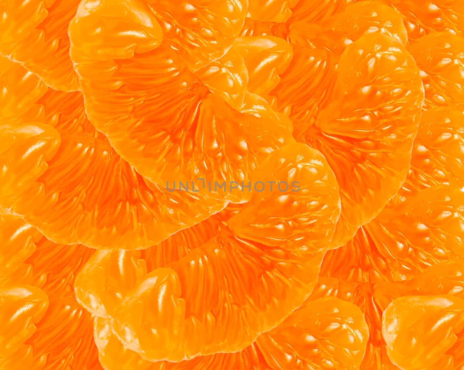 Fruit background - tangerine peeled sect