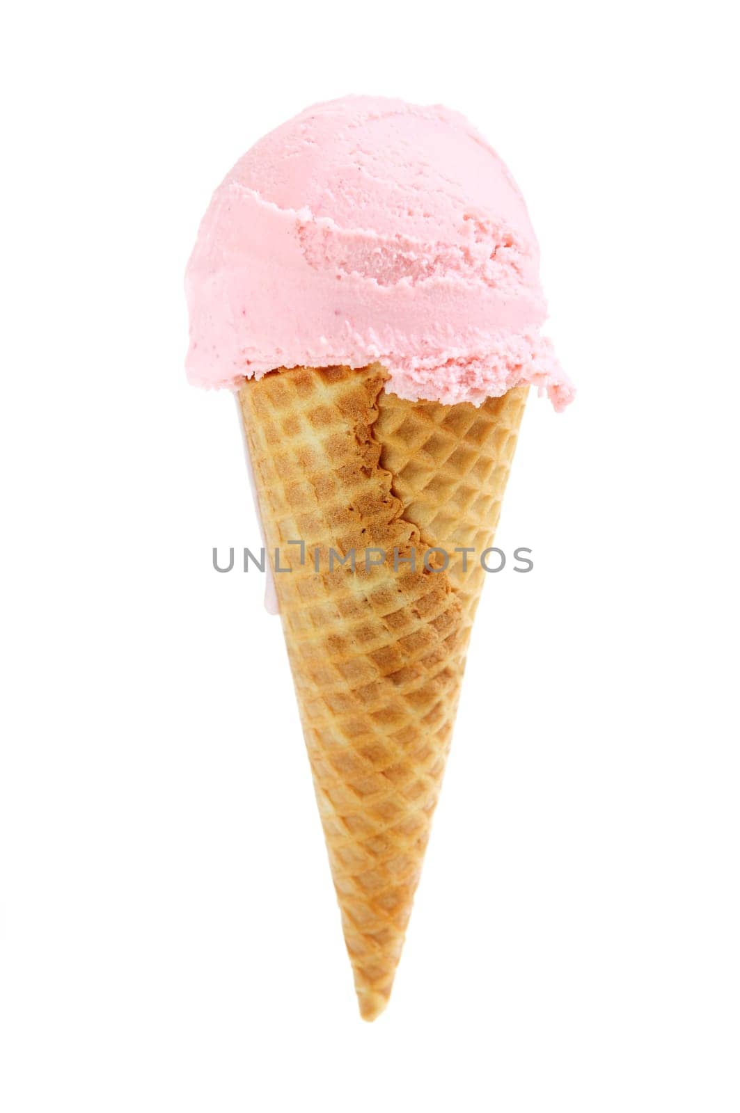 Strawberry ice cream in a sugar cone