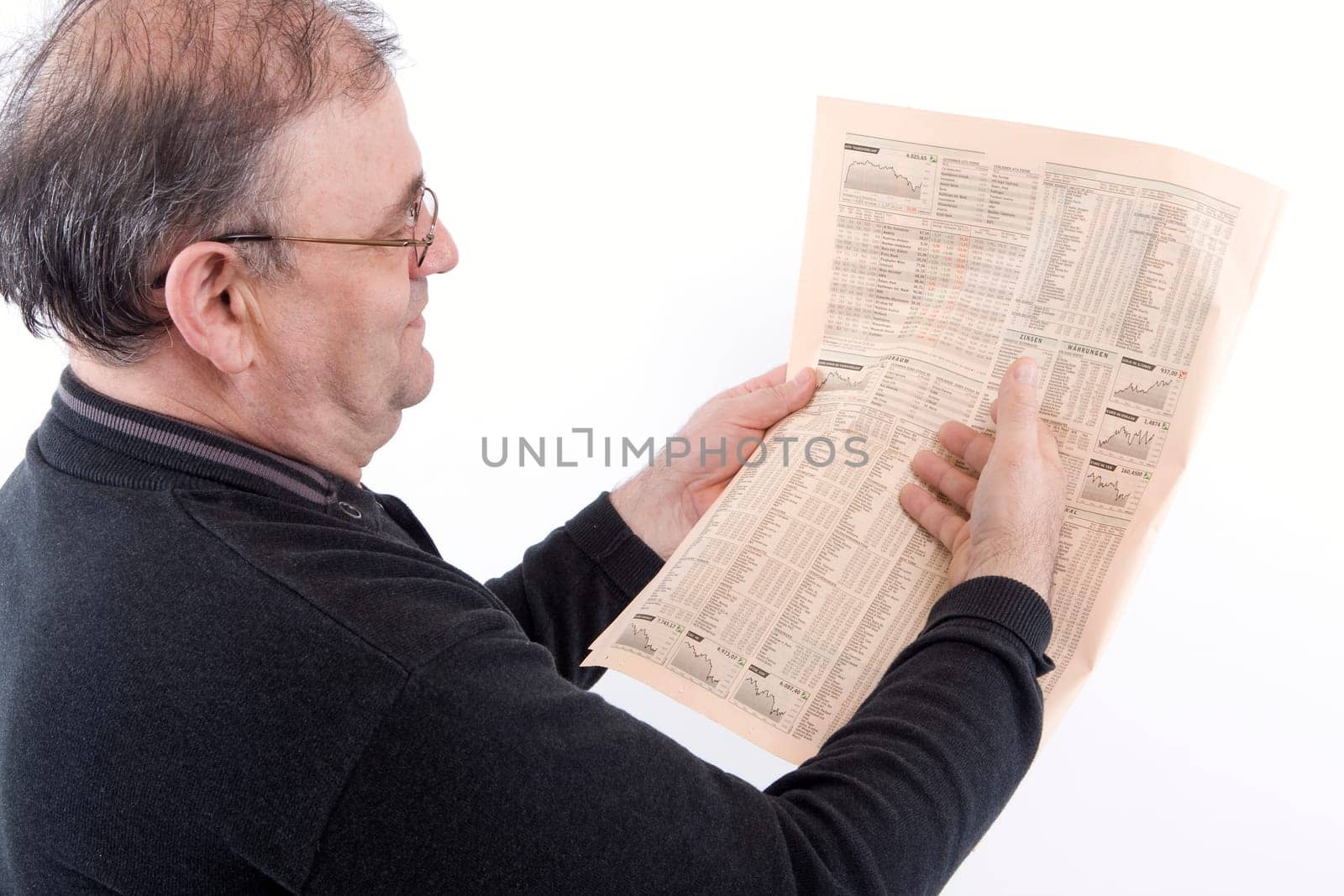 Senior reads newspaper