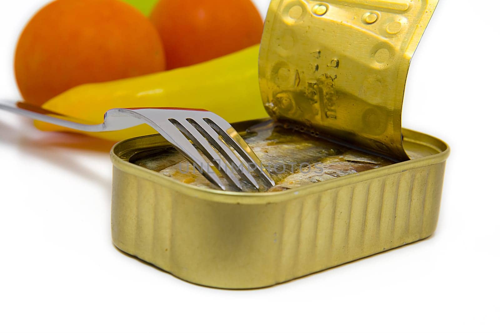 open can of sardines with fork