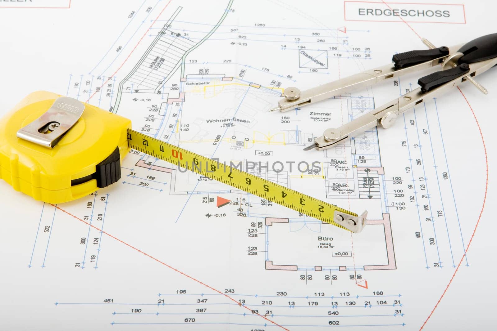 Blueprint with compass and roller meter