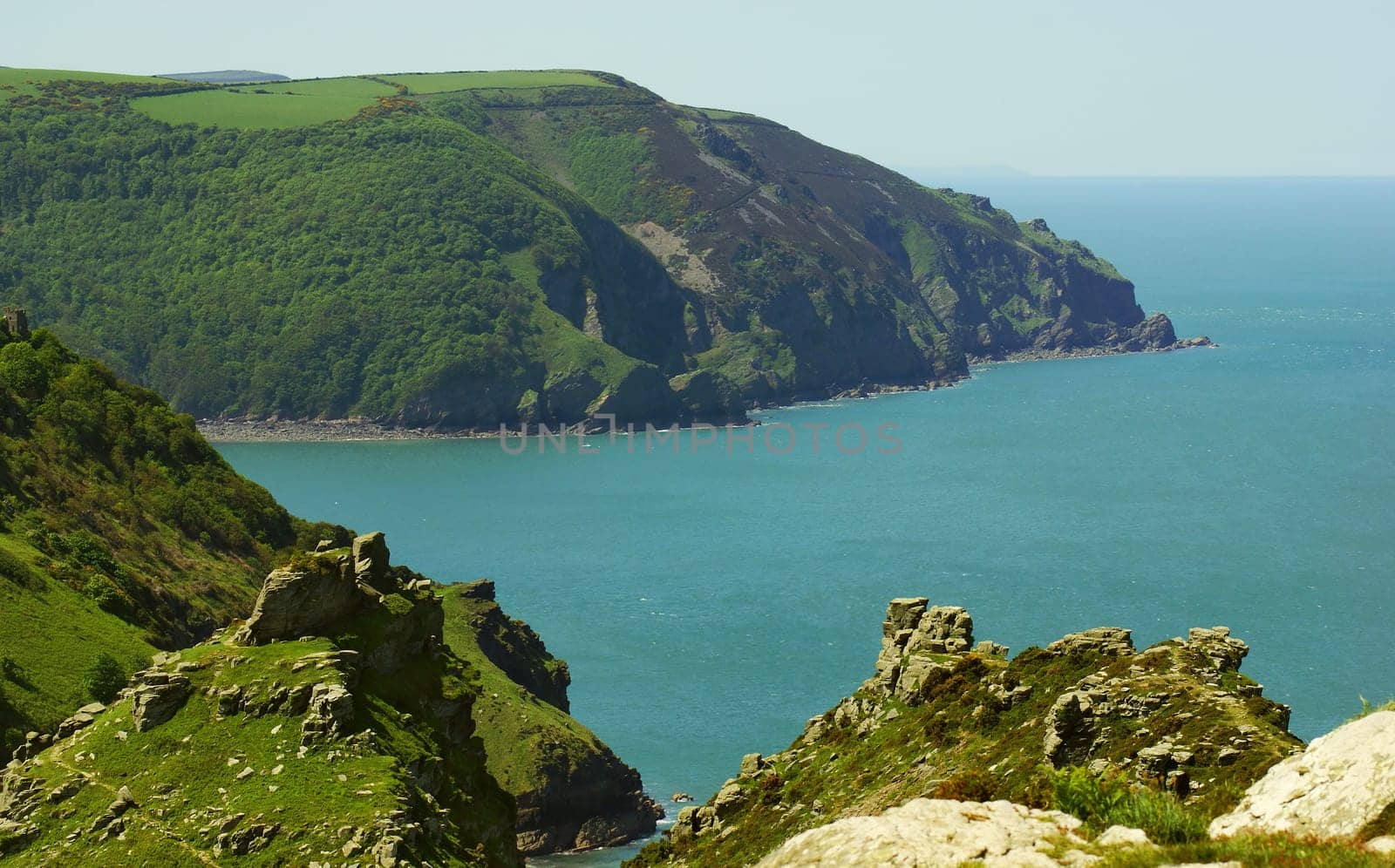 View from the South West Coast Walk across Woody Bay on the North Coast of Devon to the 200m high cliffs at Highvee Point. UK