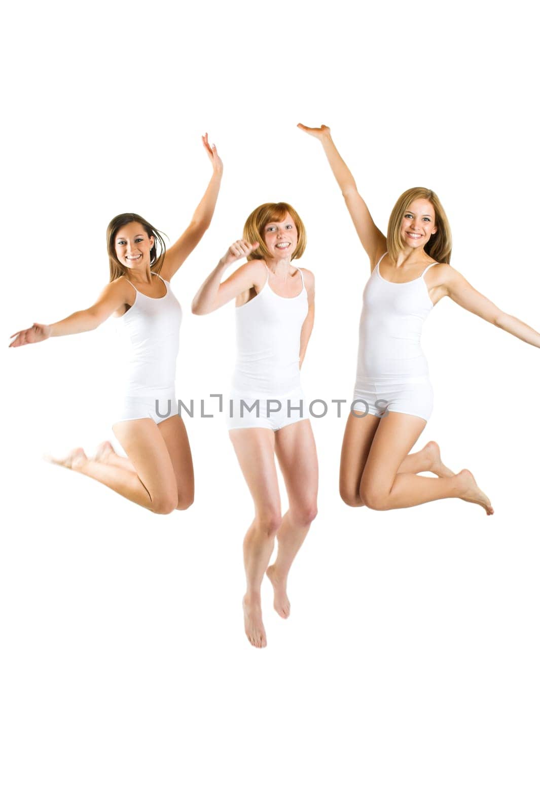 Three young women jumping