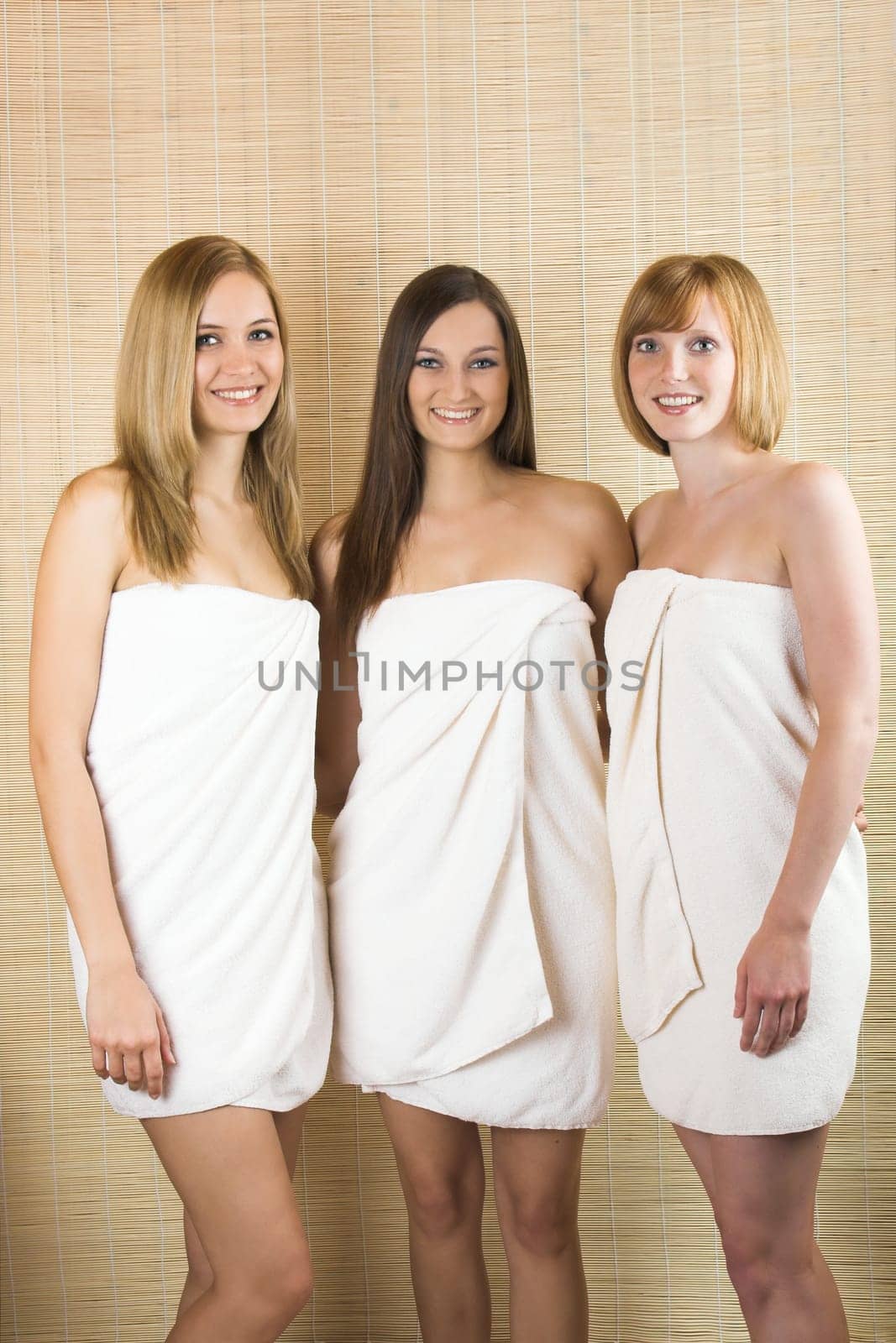 Three young women with towels
