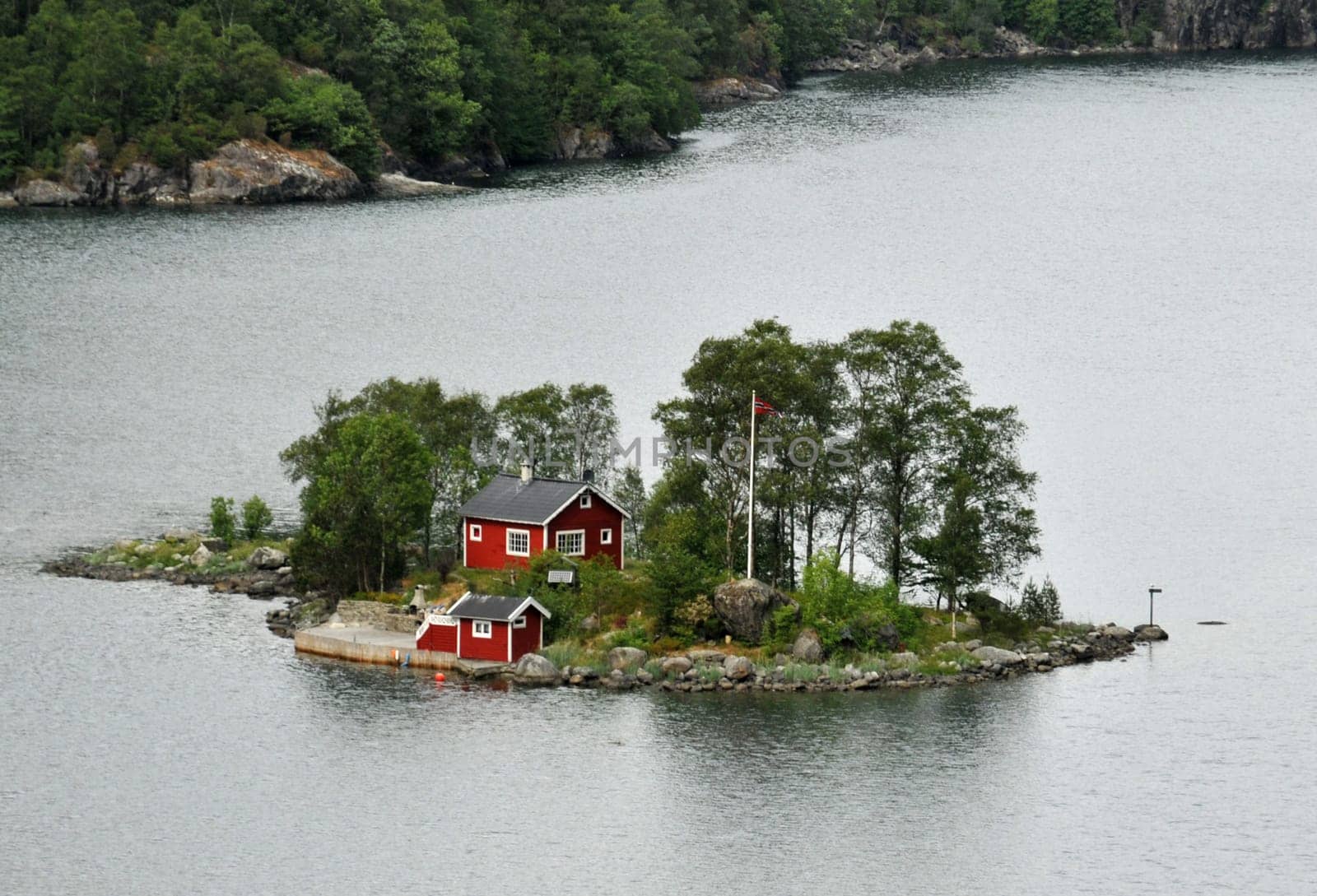 Small cottage in a fjord in Norway.