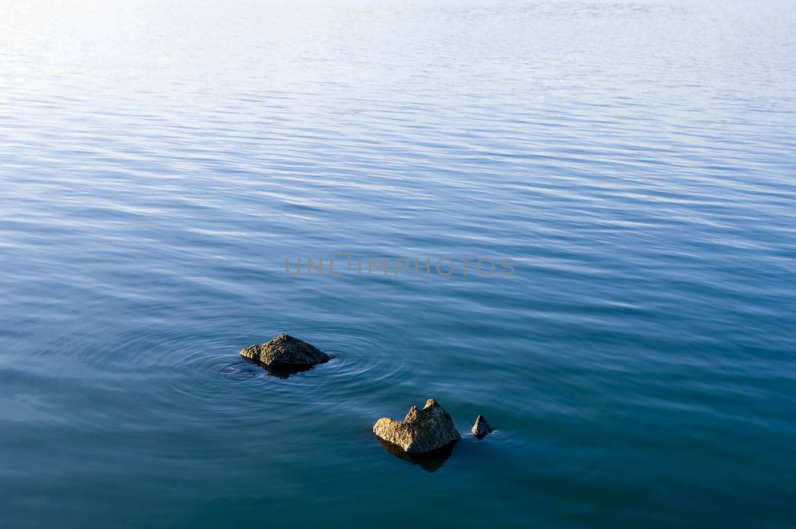 Stones in water surface