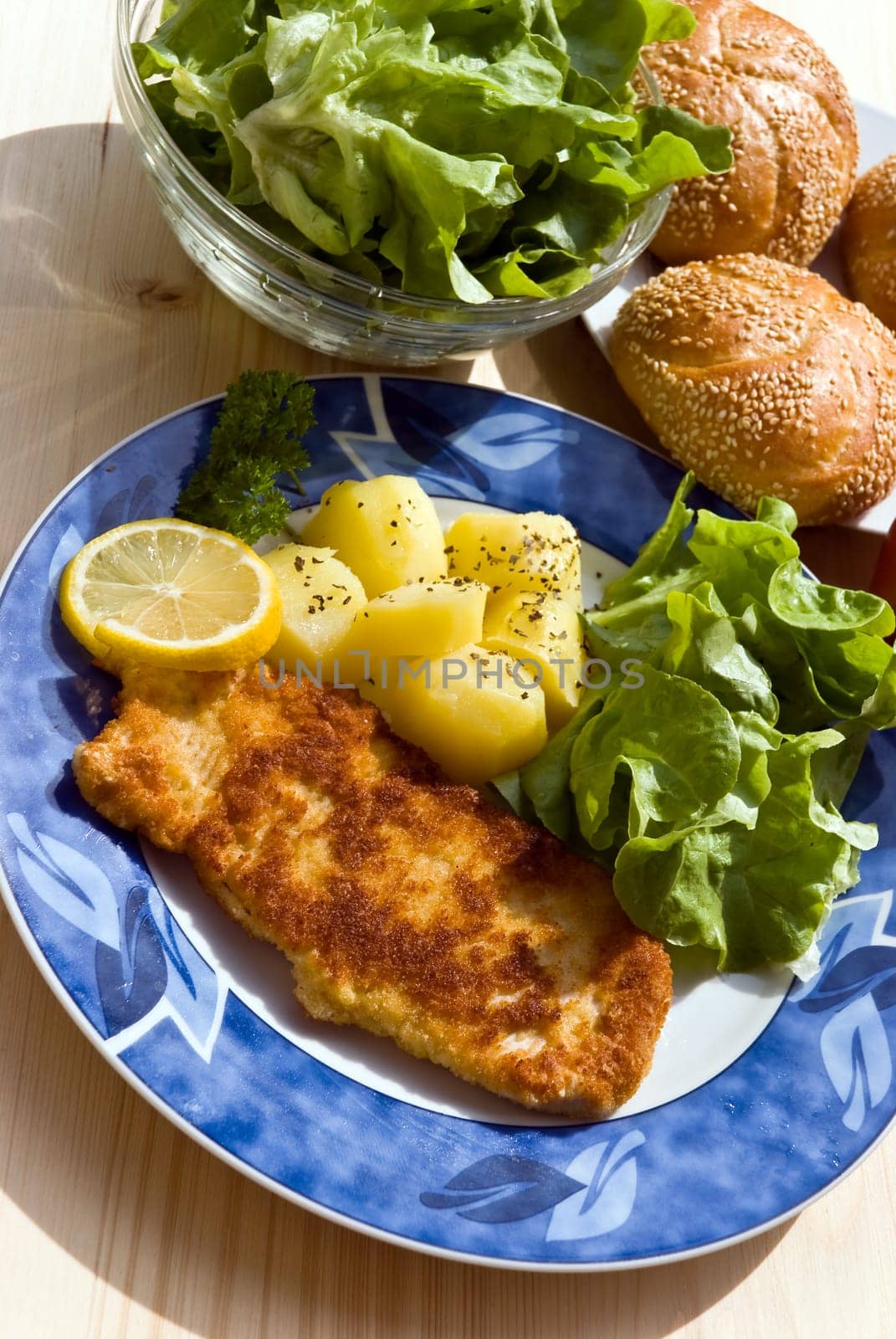 Schnitzel breaded with salad